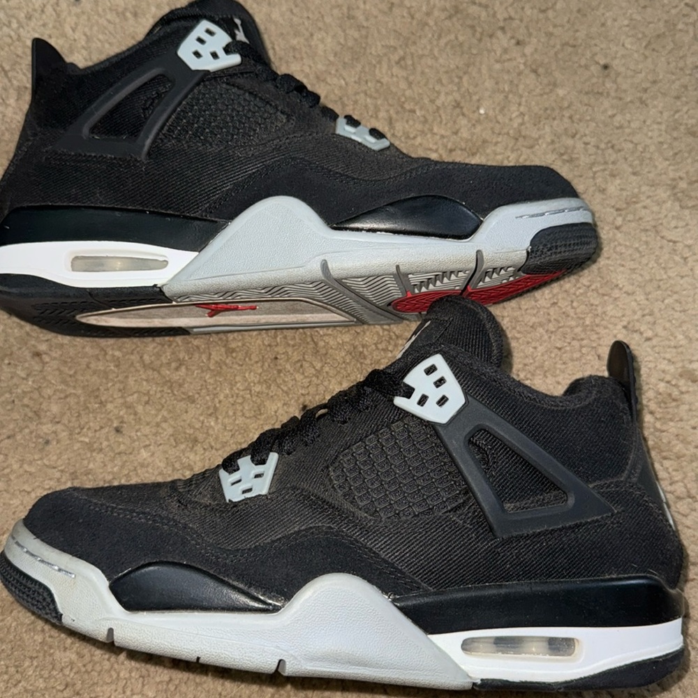 Black Jordan 4s canvas